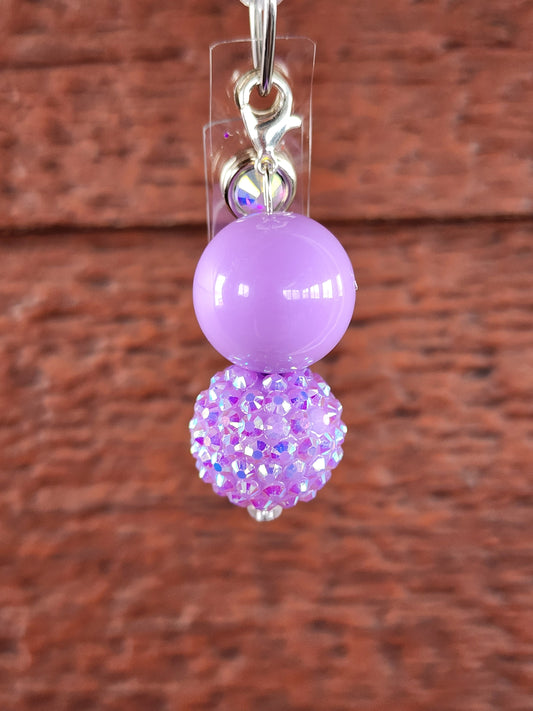 Purple badge reel bead charm